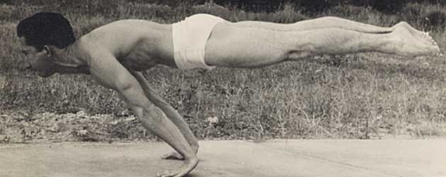 A man performing a clean planche